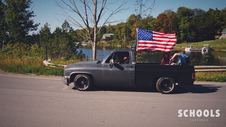 Dark gray with flag + people in bed